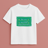 Faith-based personalised kids T-shirt with ‘Be Kind’ message in playful fonts on white tee – Keino Kids Kindness Collection