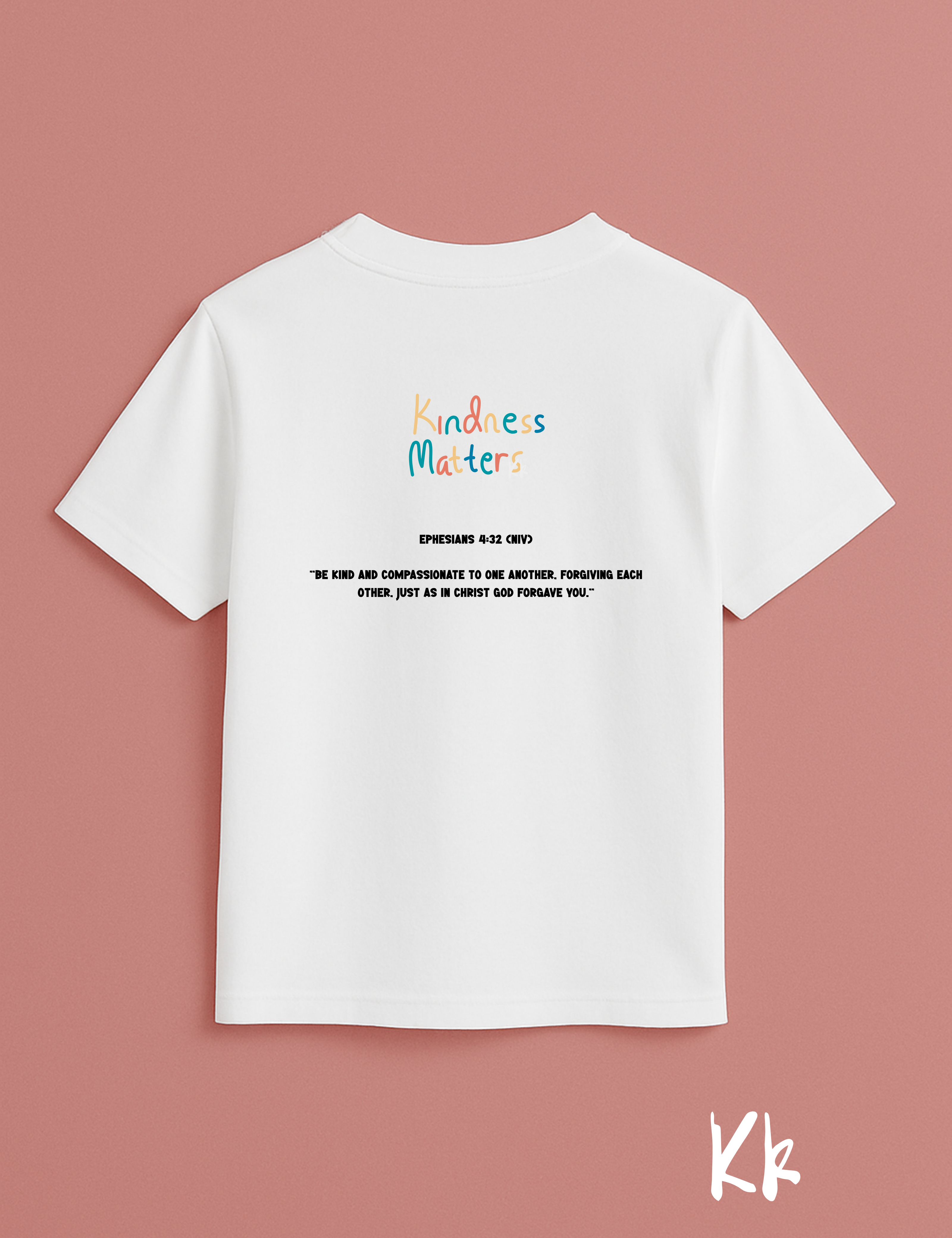 White t-shirt with 'Kindness Matters' text on a pink background