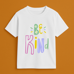 White t-shirt with 'Be Kind' text in colorful letters on a brown background