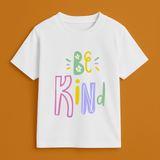White t-shirt with 'Be Kind' text in colorful letters on a brown background