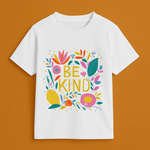 White t-shirt with colorful 'BE KIND' design on a brown background