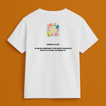 White t-shirt with colorful graphic and text on a brown background